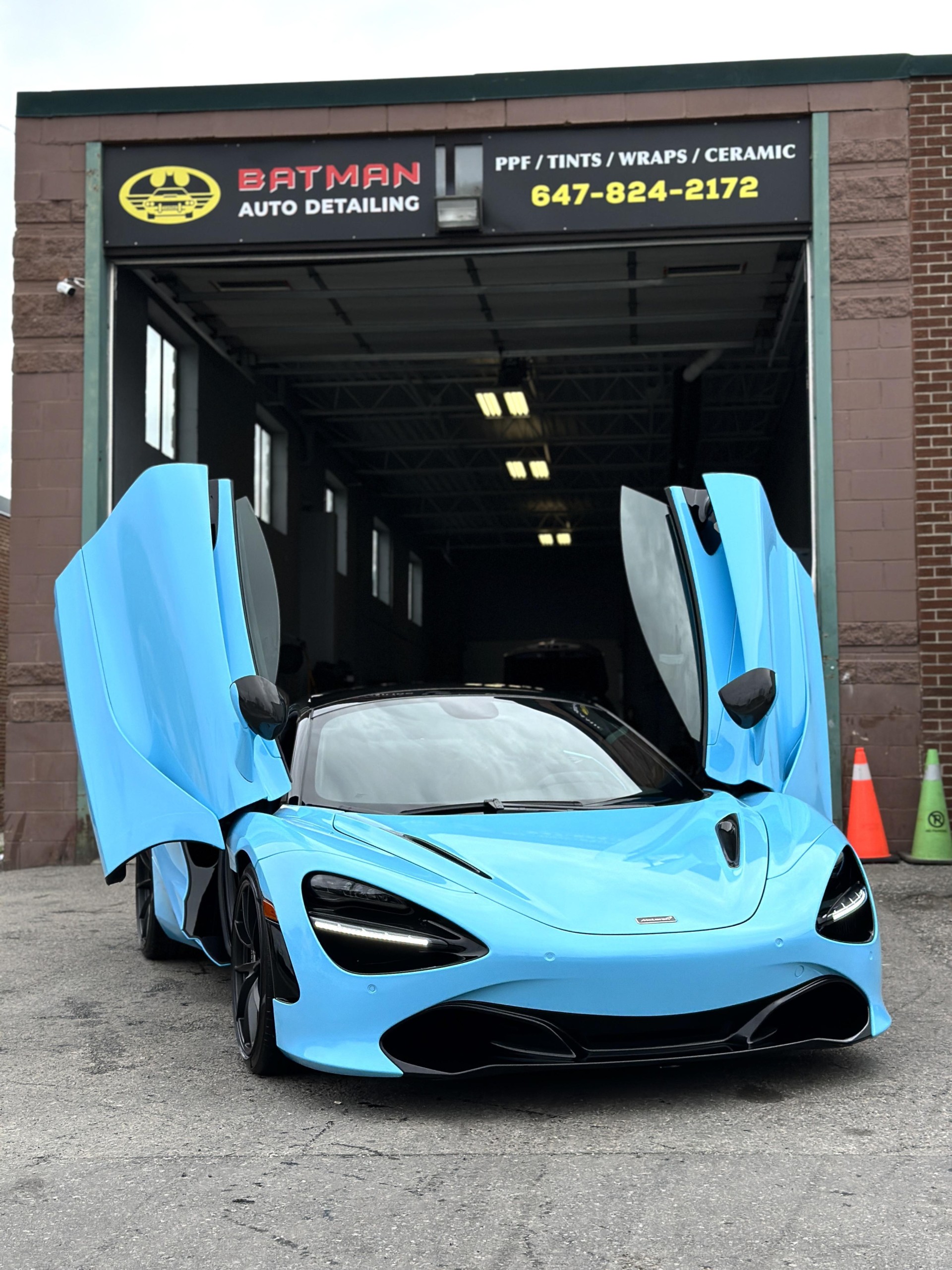 Blue McLaren 720S outside the Batman Auto Detailing shop in North York